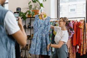 Girl showing dress to a photographer