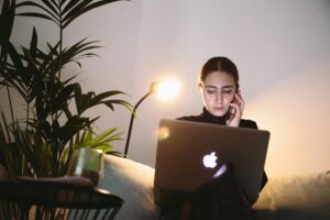 Girl with phone and laptop