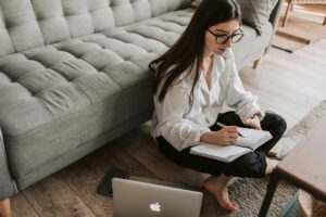 Girl writing on her notebook