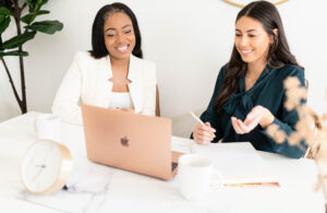 two girls looking at laptop